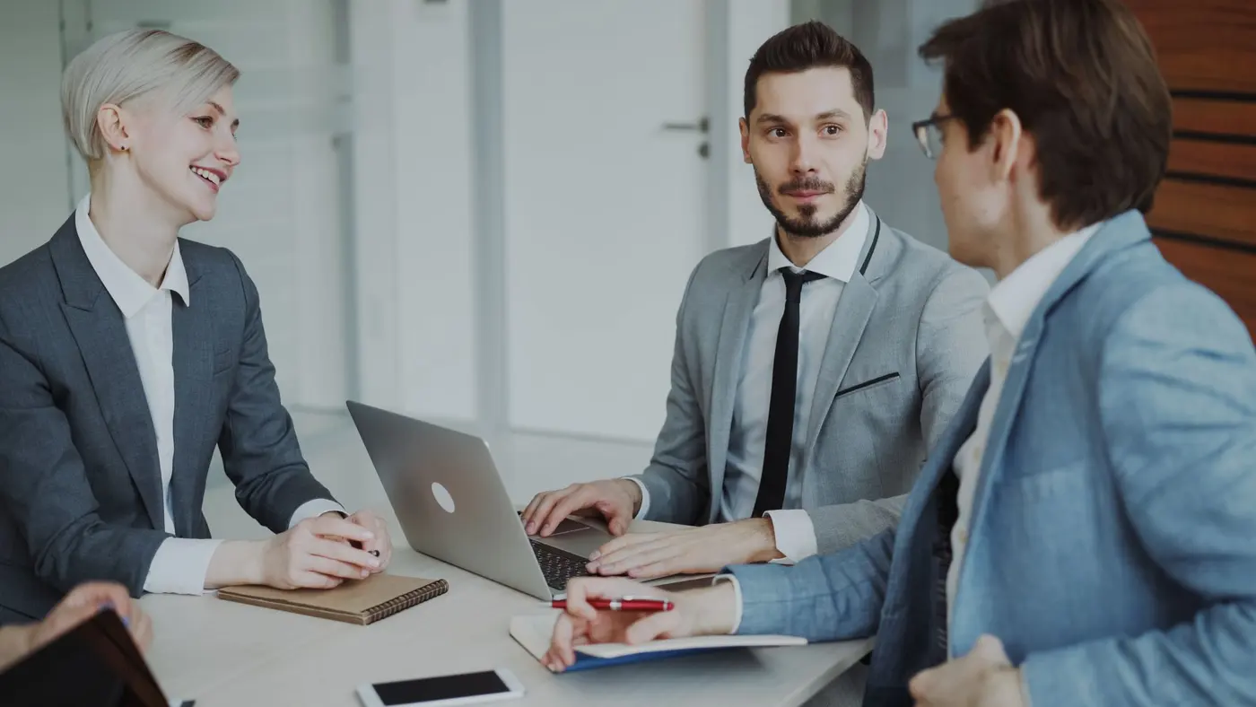 Two consultants reviewing a growth plan in a modern boardroom